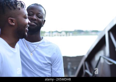 USA, Louisiana, Smiling gay couple on bridge Stock Photo