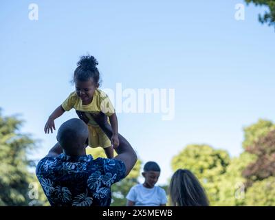 Father lifting son (2-3) in air Stock Photo