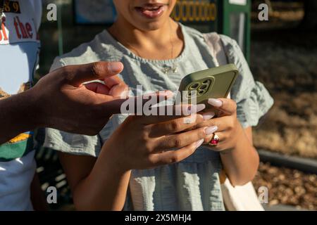 Close-up of couple using smart phone Stock Photo