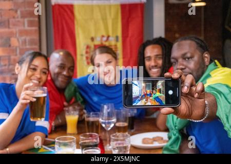 Group of friends taking?selfie in pub Stock Photo