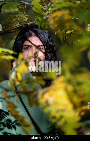 Portrait of woman in forest Stock Photo