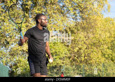 Man playing tennis Stock Photo