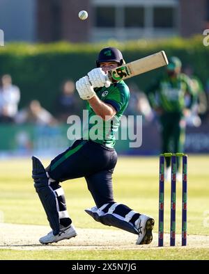 Ireland's Curtis Campher hits the winning run during the first T20 international at Castle Avenue Cricket Ground, Dublin. Picture date: Friday May 10, 2024. Stock Photo