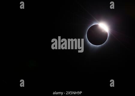 USA, Wyoming. Total solar eclipse. The 'Diamond Ring' effect is seen as the moon makes its final move over the sun. The ring is the sun's corona. Stock Photo