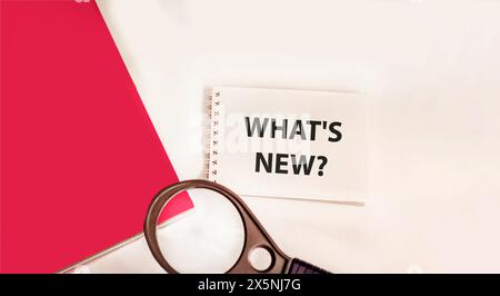 Text sign showing what's new on a notepad Stock Photo