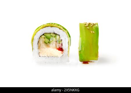 Closeup of appetizing sushi roll filled with tempura perch, cream cheese, cucumber and tobiko roe wrapped in thin avocado slices, isolated on white ba Stock Photo