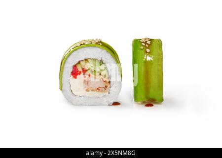 Closeup of appetizing sushi roll filled with tempura shrimp, cream cheese, cucumber and tobiko roe wrapped in thin avocado slices, isolated on white b Stock Photo