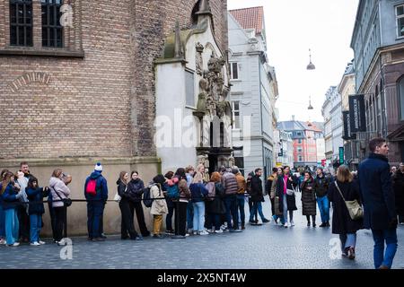 Copenhagen, Denmark - April 6, 2024: People waiting in line to enter The Round Tower. Stock Photo