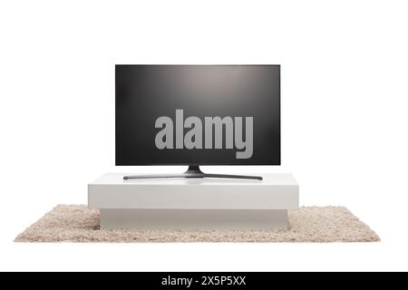Tv screen on a white television stand isolated on white background Stock Photo