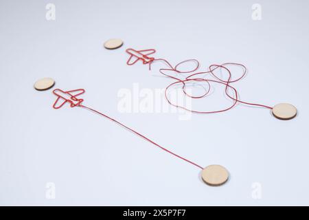 Legs in white sneakers in front of straight and tangled arrows Stock Photo