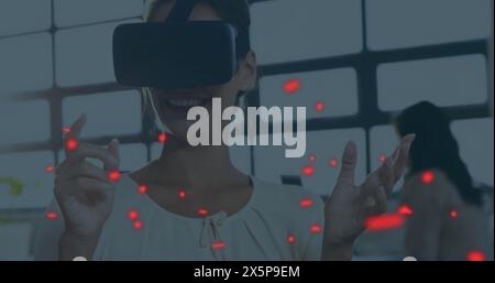 Caucasian woman in VR headset using digital interface Stock Photo