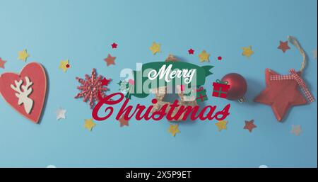 Various Christmas decorations are scattered on blue background Stock Photo