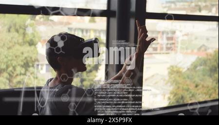 A person wearing virtual reality headset reaching out Stock Photo