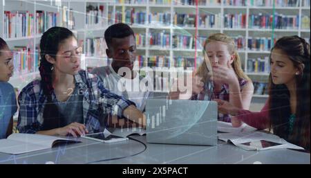 Image of graphs and globe over diverse students discussing project over laptop in library Stock Photo