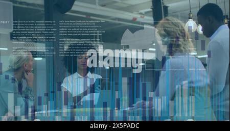 Diverse colleagues are discussing work behind glass walls Stock Photo