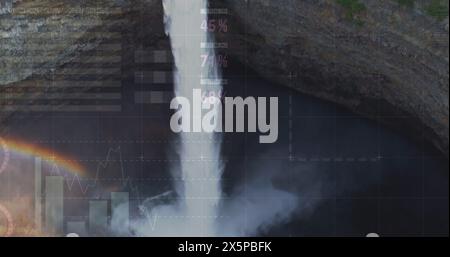 Image of financial graphs and data over waterfall Stock Photo