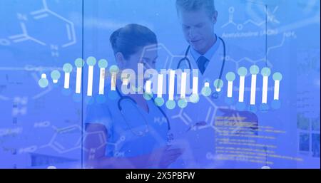 Image of data processing and dna strand spinning over diverse doctors Stock Photo