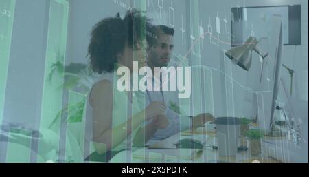 Image of graphs and changing numbers over diverse coworkers discussing reports on computer Stock Photo