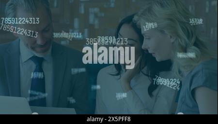 Image of financial data processing against group of diverse businesspeople discussing at office Stock Photo