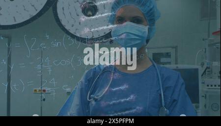 Image of brain rotating over caucasian female surgeon in face mask Stock Photo