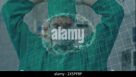 Image of brain rotating over caucasian female surgeon putting on face mask Stock Photo