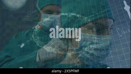 Image of brain rotating over caucasian male surgeon tying face mask to female colleague Stock Photo