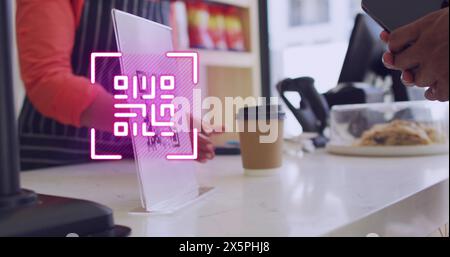 Image of qr code scanning over man paying with smartphone in shop Stock Photo