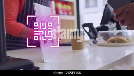 Image of qr code scanning over man paying with smartphone in shop Stock Photo