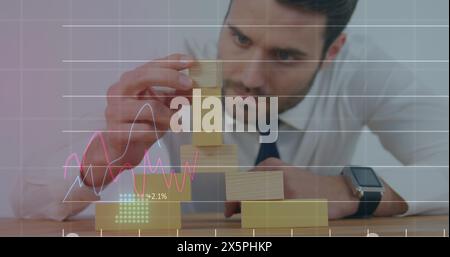 Image of financial data processing over caucasian businessman Stock Photo