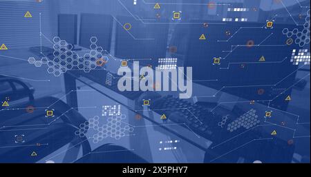 Data processing over computers on desks in empty office Stock Photo