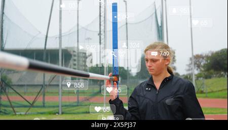 Image of icon and changing numbers in notification bars, caucasian woman checking rod Stock Photo