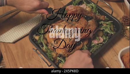 Image of happy thanksgiving day text over hands cutting turkey Stock Photo