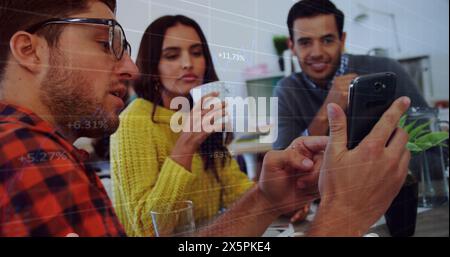Image of data processing over three diverse colleagues discussing over a smartphone at office Stock Photo