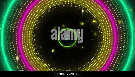 Image of neon circles over flashing yellow light pattern Stock Photo