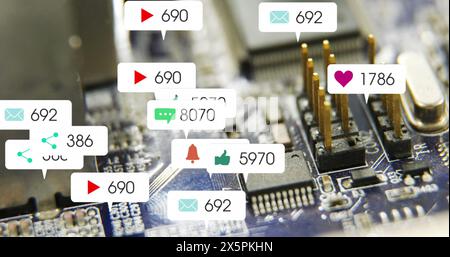 Image of multiple social media icons against close up of a motherboard Stock Photo