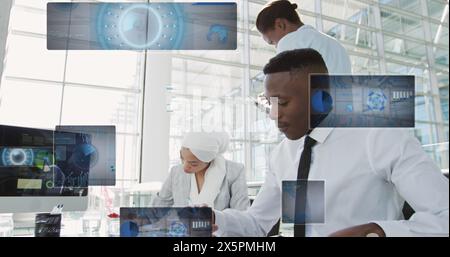 Image of radars, pie charts over diverse coworkers analyzing reports on desktop in office Stock Photo