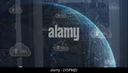 Image of arrow and changing numbers in clouds over globe against back panel of server racks Stock Photo
