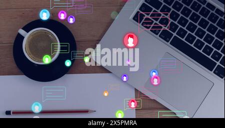 Image of profile icons floating against laptop, coffee cup, pencil, blank paper on wooden table Stock Photo
