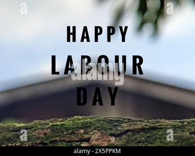 Text HAPPY LABOUR DAY with blurry house background Stock Photo