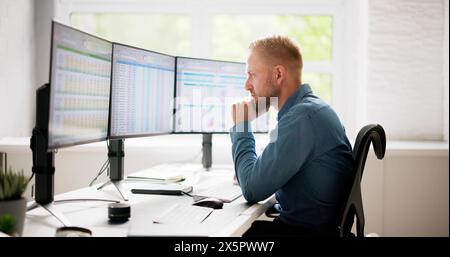 Data Analyst Man Using Spreadsheet On Computer Stock Photo