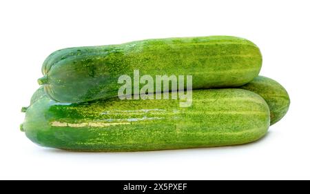 Side view of fresh green cucumbers in stack is isolated on white background with clipping path. Stock Photo