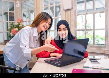 Portrait of multiethnic business colleagues discussing a business project plan during a meeting at the cafe Stock Photo