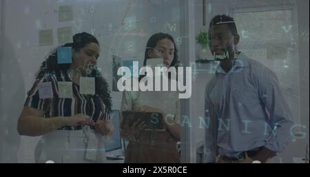 Diverse group of coworkers discussing over notes on glass Stock Photo