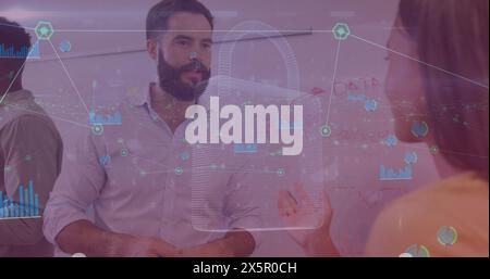 Diverse group of coworkers discussing over transparent digital screen Stock Photo