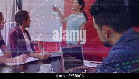 A diverse group of professionals is working together, analyzing data on screens Stock Photo