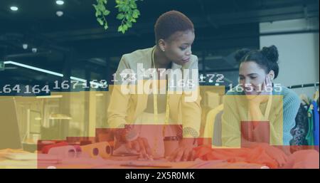 Image of statistical data processing over diverse female fashion designers discussing at studio Stock Photo