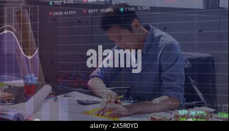 Image of financial data processing over asian businessman Stock Photo