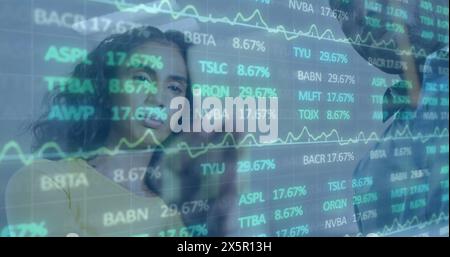 Image of trading board over diverse coworkers discussing strategy on sticky notes Stock Photo