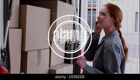 Image of changing numbers in circles, caucasian woman talking on cellphone while checking boxes Stock Photo