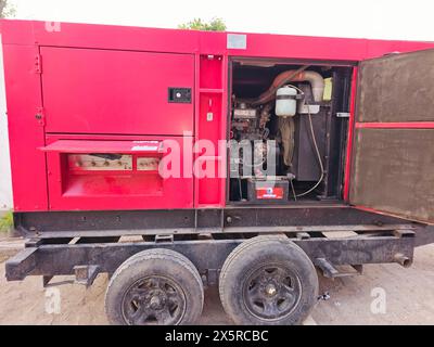 Cairo, Egypt, April 24 2024: Mobile electric generator, a device that converts motion-based power or fuel-based power (chemical energy) into electric Stock Photo